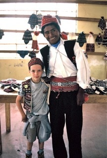 boy dressing in traditional clothing in Puno, Peru