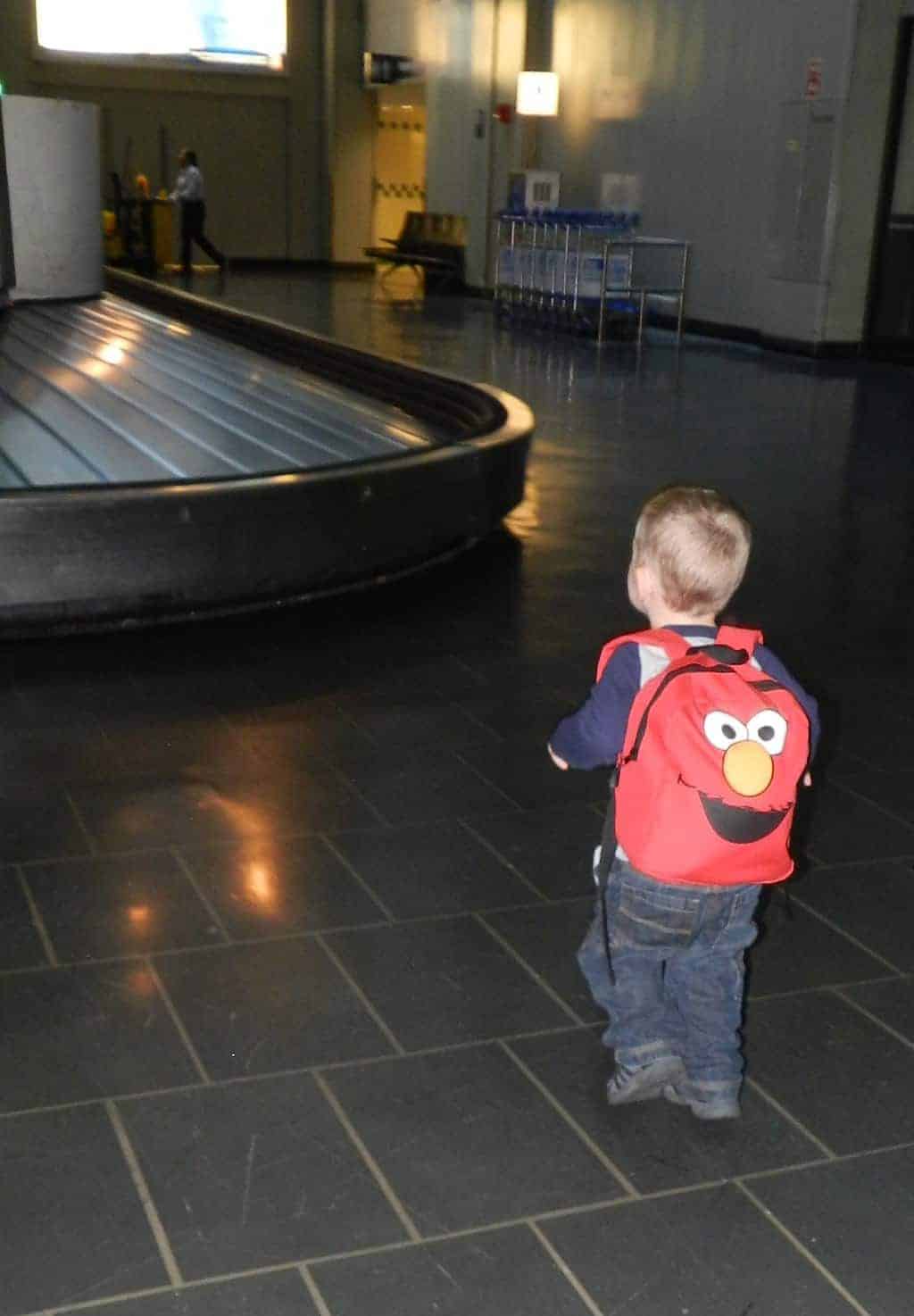 kid with Elmo backpack in airport