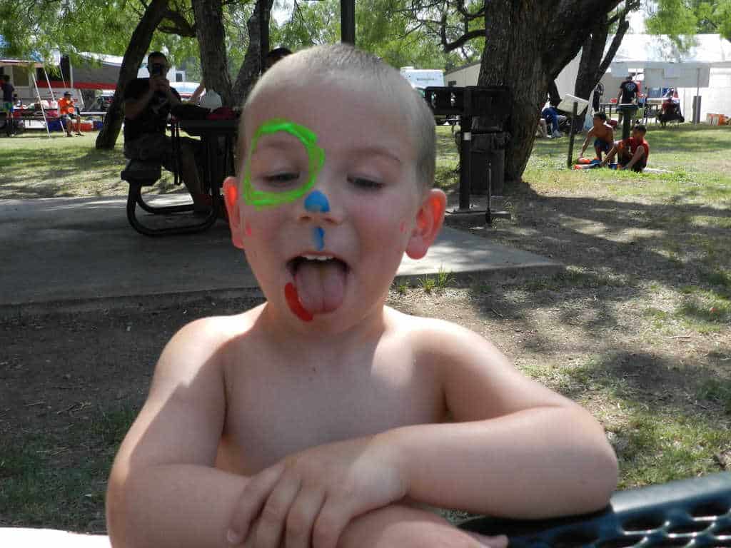 toddler with face painted