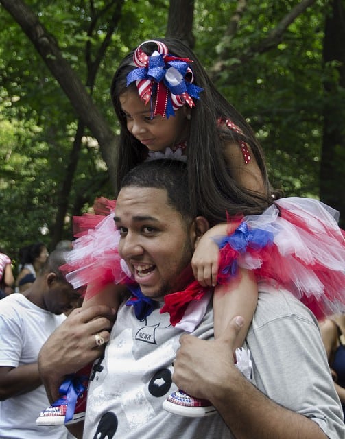 girl on man's shoulders at event in Puerto Rico