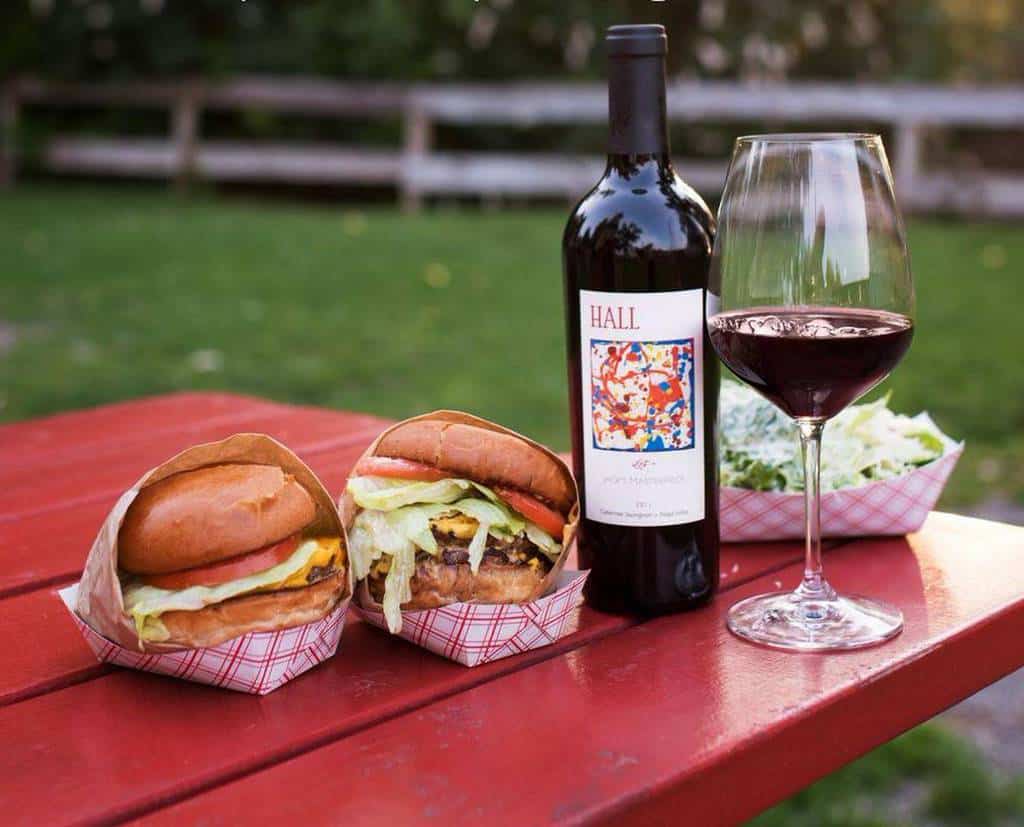 hall wine's Jack's Masterpiece at a picnic with burgers