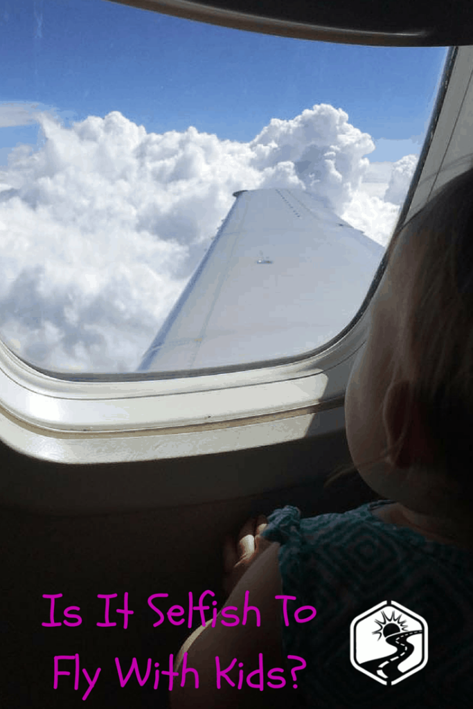 Baby looking out plane window