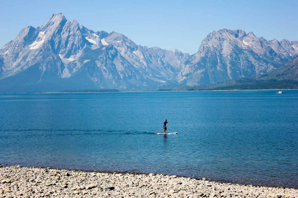 Stand up paddle boarding on Jackson Lake in the Grand Tetons
