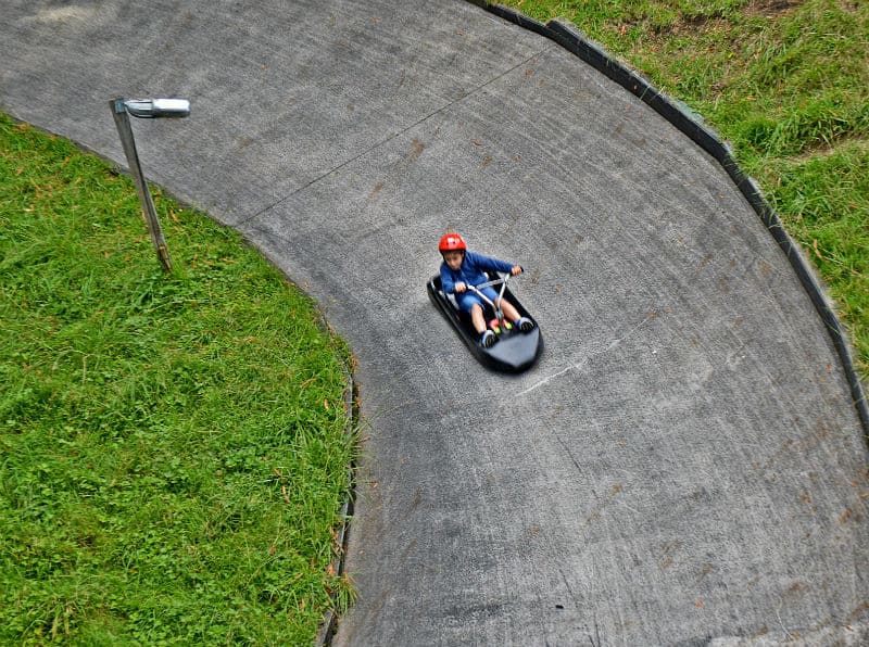 Young boy on luge track in Rotorua, New Zealand