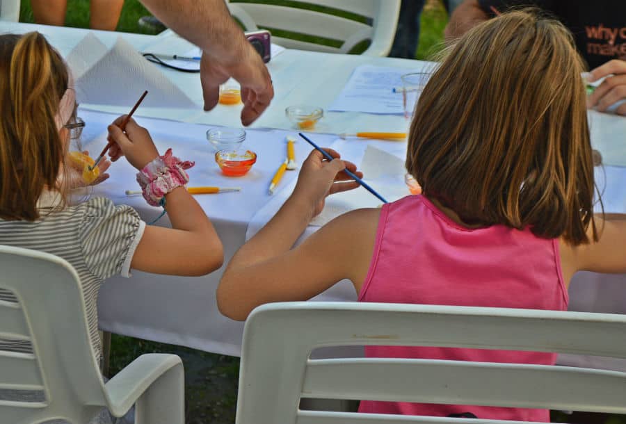Kids painting marzipan sweets in Loule, Portugal