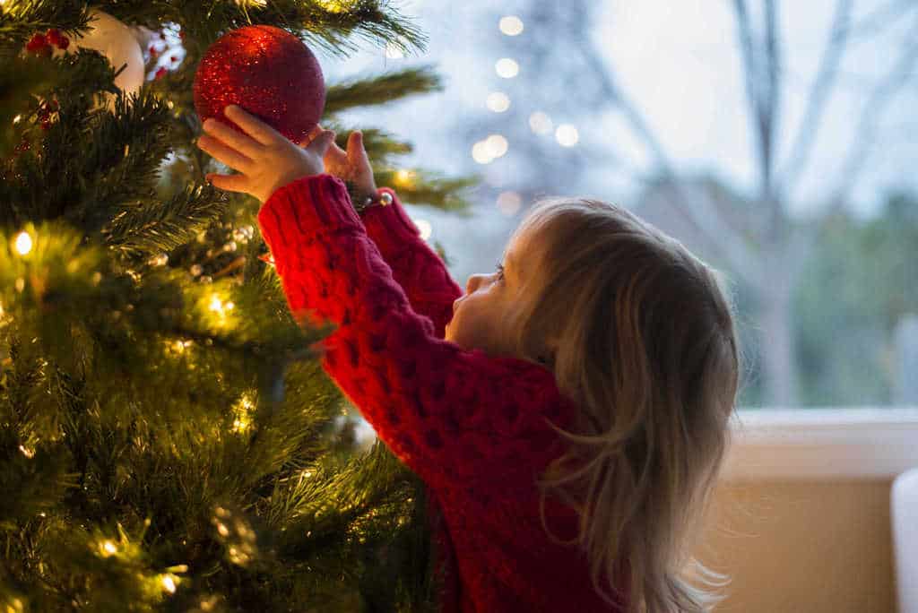 Toddler Girl hanging ornament on Christmas tree by Donnie Ray Jones on Flickr