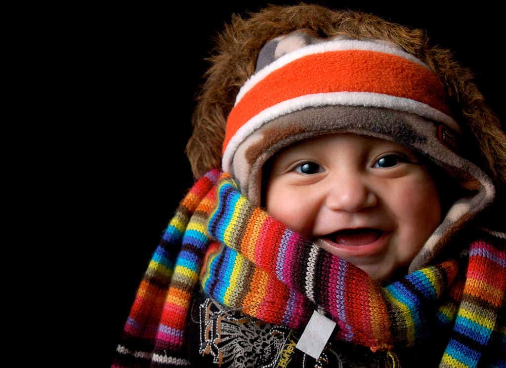 Baby wrapped in scarves by Andrew Vargas