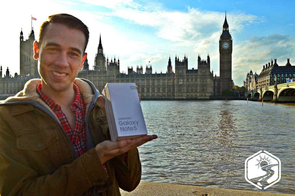 Gary in front of Parliament in London holding a Samsung Galaxy Note 5 box