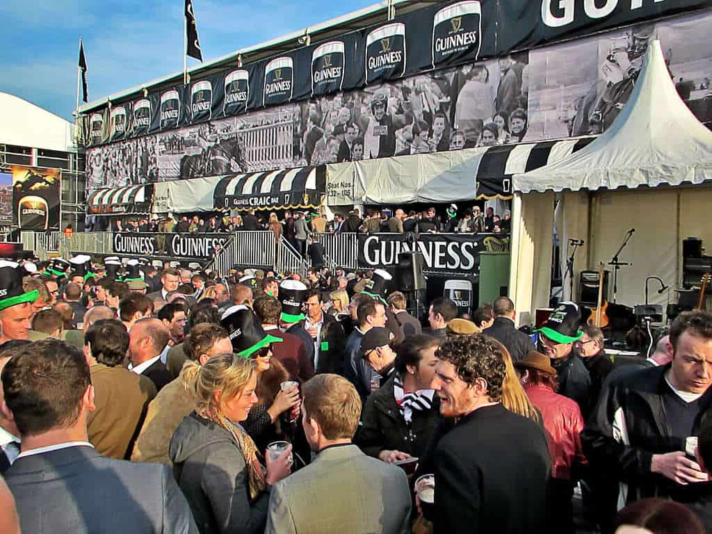 crowd in front of Guinness tent at cheltenham festival in england, photo by magic foundry via flickr