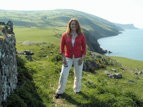 woman standing on cliffs in Ireland