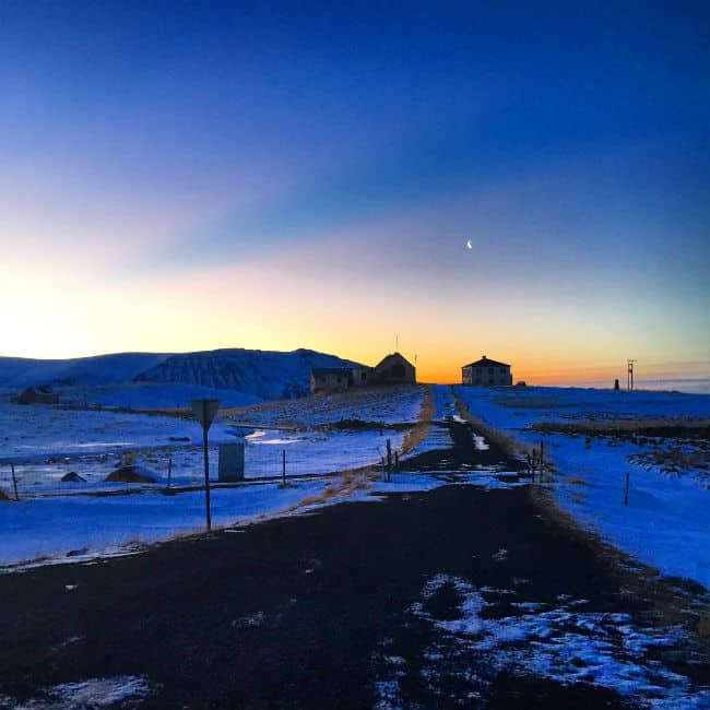 sunrise over road in west iceland during the winter