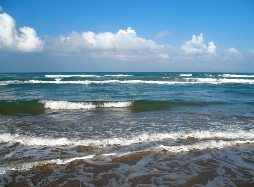 waves and sand and sky on south padre island in texas