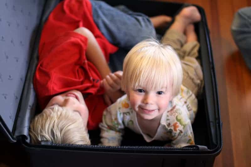 Kids playing in suitcase