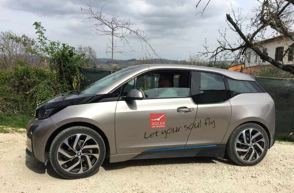 electric cars bmw at adler thermae tuscany italy by eileen cotter wright