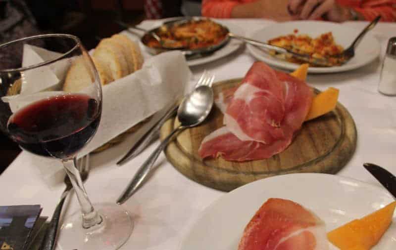 Prosciutto+ Melon and red wine glass in florence italy