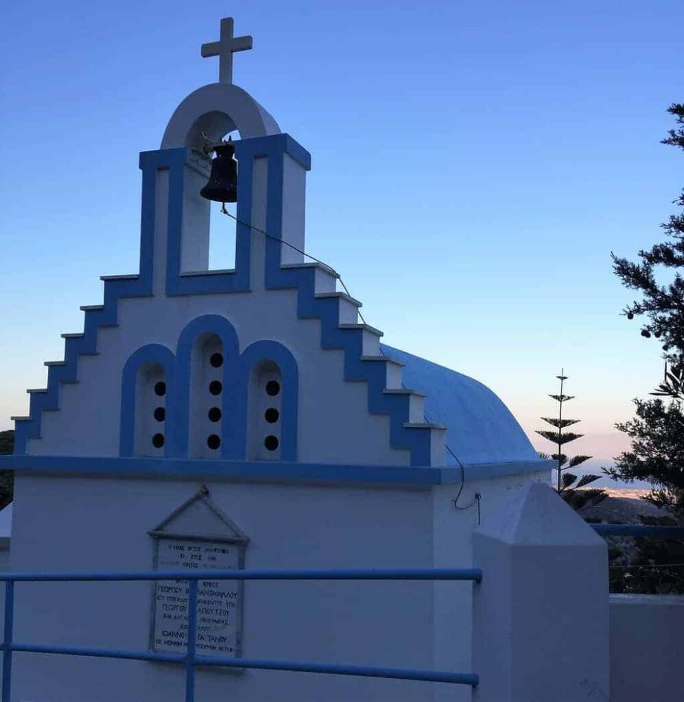 white and blue church in lefkes paros greece