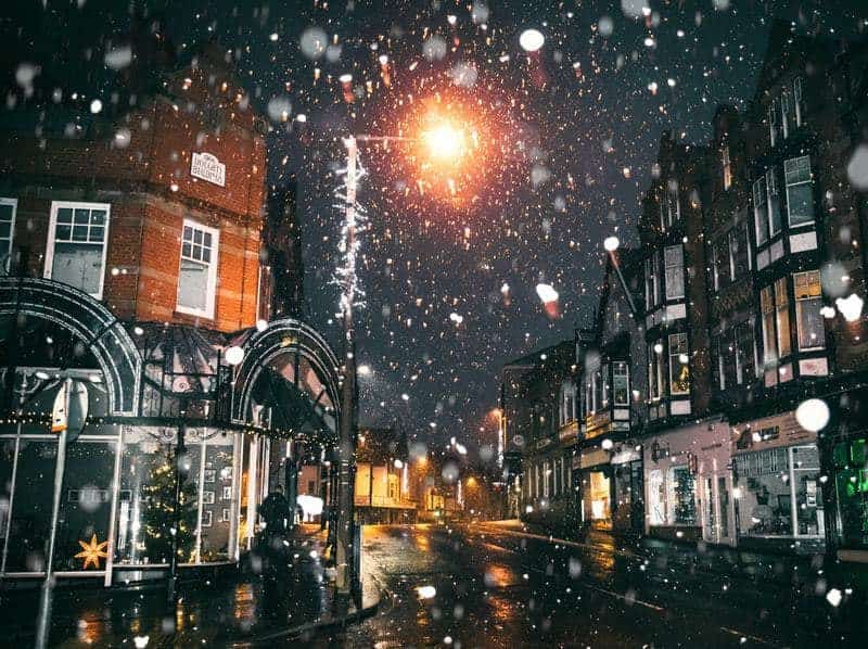 The UK with snowfall in the city at night