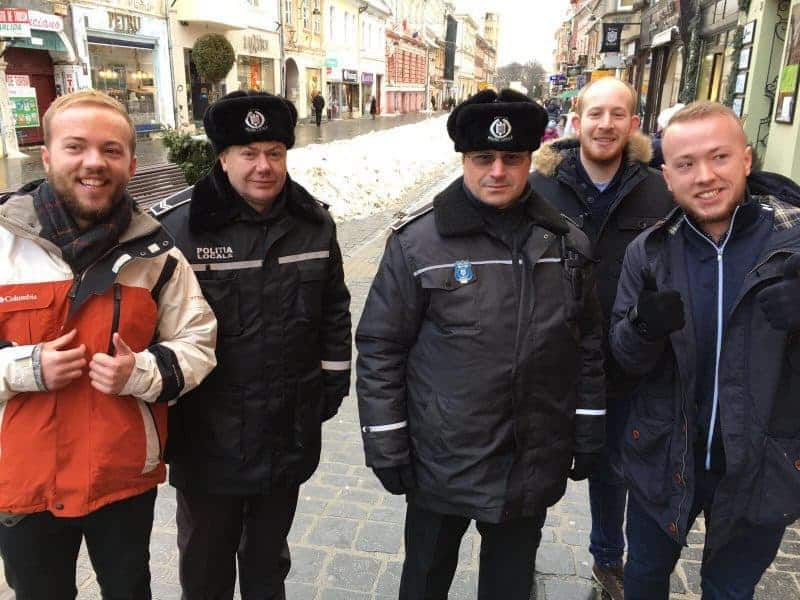 Lads in Brasov, Romania with local cops in snow