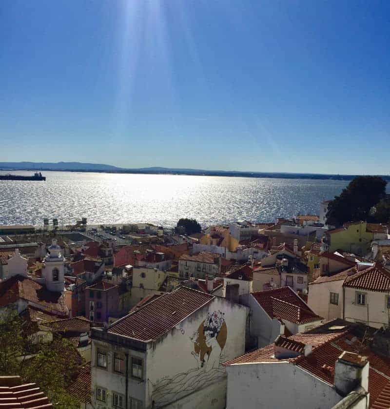 lisbon portugal rooftops sunshine river