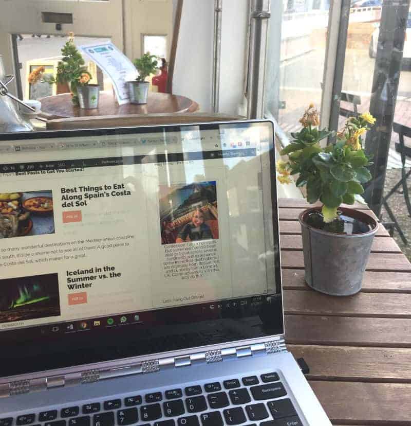 remote work in london cafe with laptop digital nomad jobs