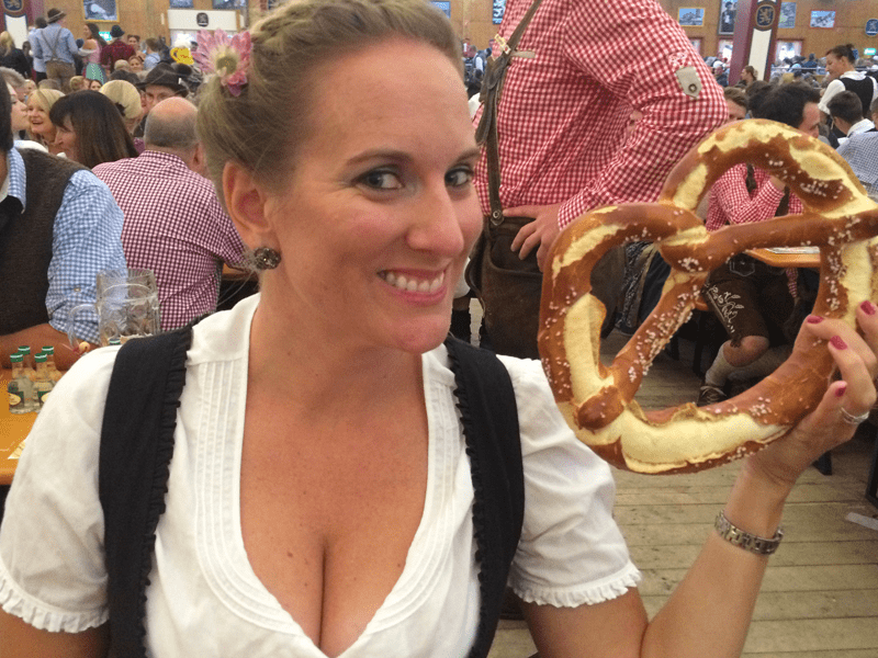Girl with a pretzel at Oktoberfest.