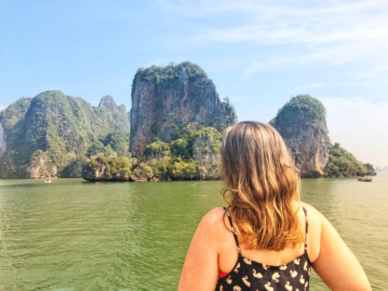 woman overlooking islands in phang nga bay, thailand