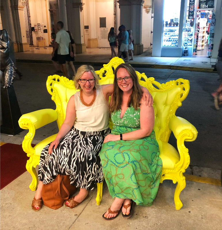 two women on a couch on uval street key west florida