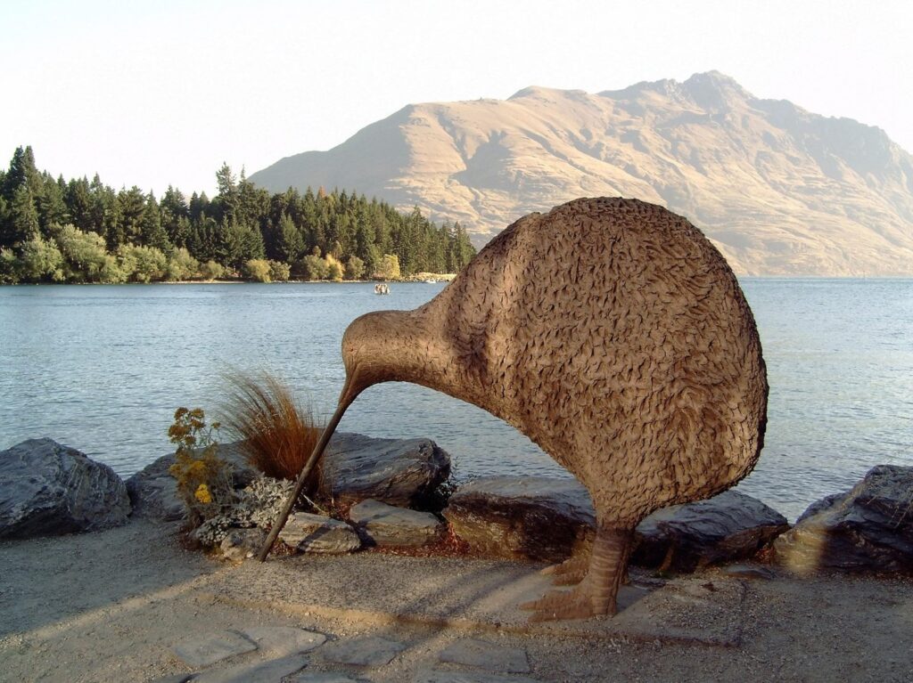 Kiwi statue in front of water in new zealand