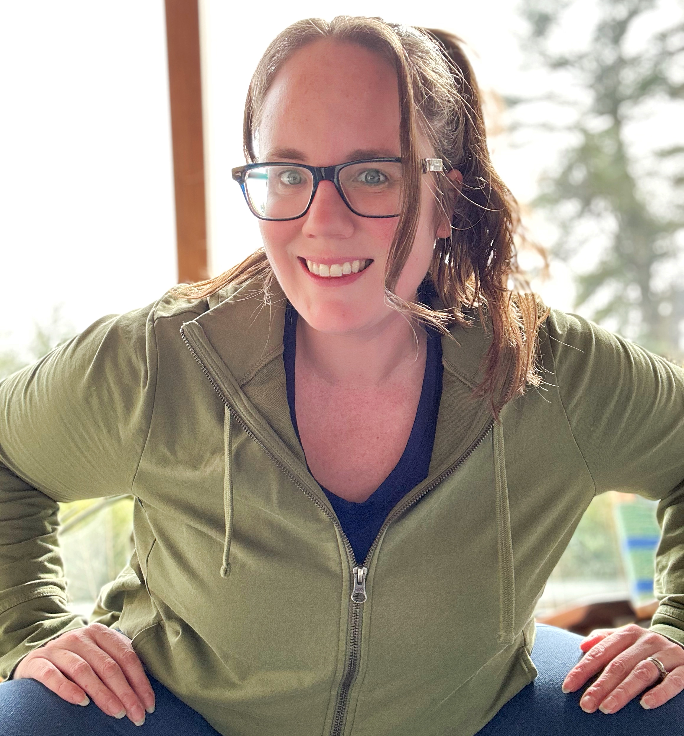 Eileen Cotter Wright in green hoodie from Pact and long sleeve navy shirt from Unbound Merino