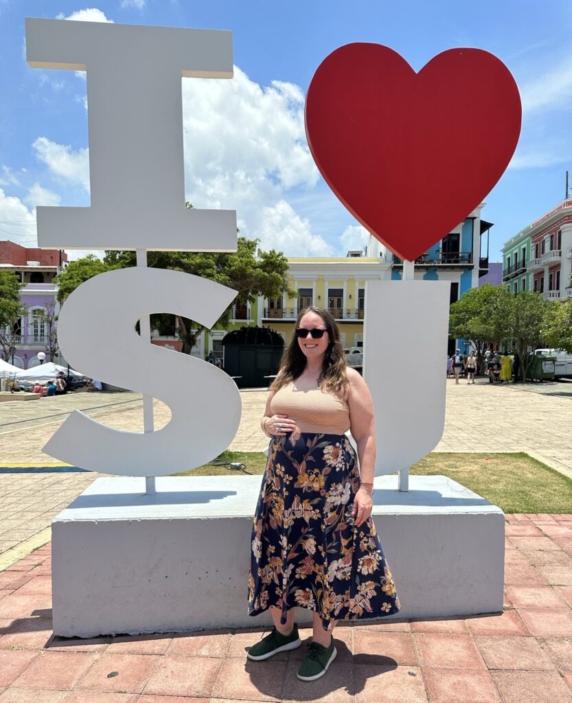 Eileen in san juan puerto rico in front of the i heart SJ sign wearing Pact dress