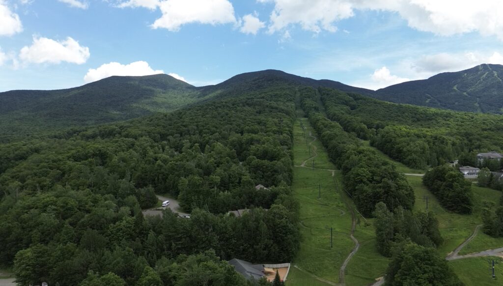 drone view of smugglers notch ski mountain in summer vermont