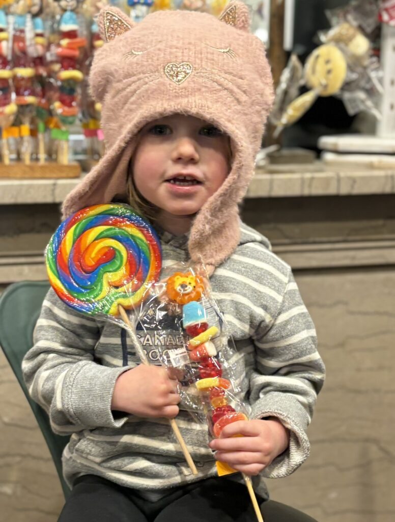 toddler at zebs north conway new hampshire downtown with lollipop