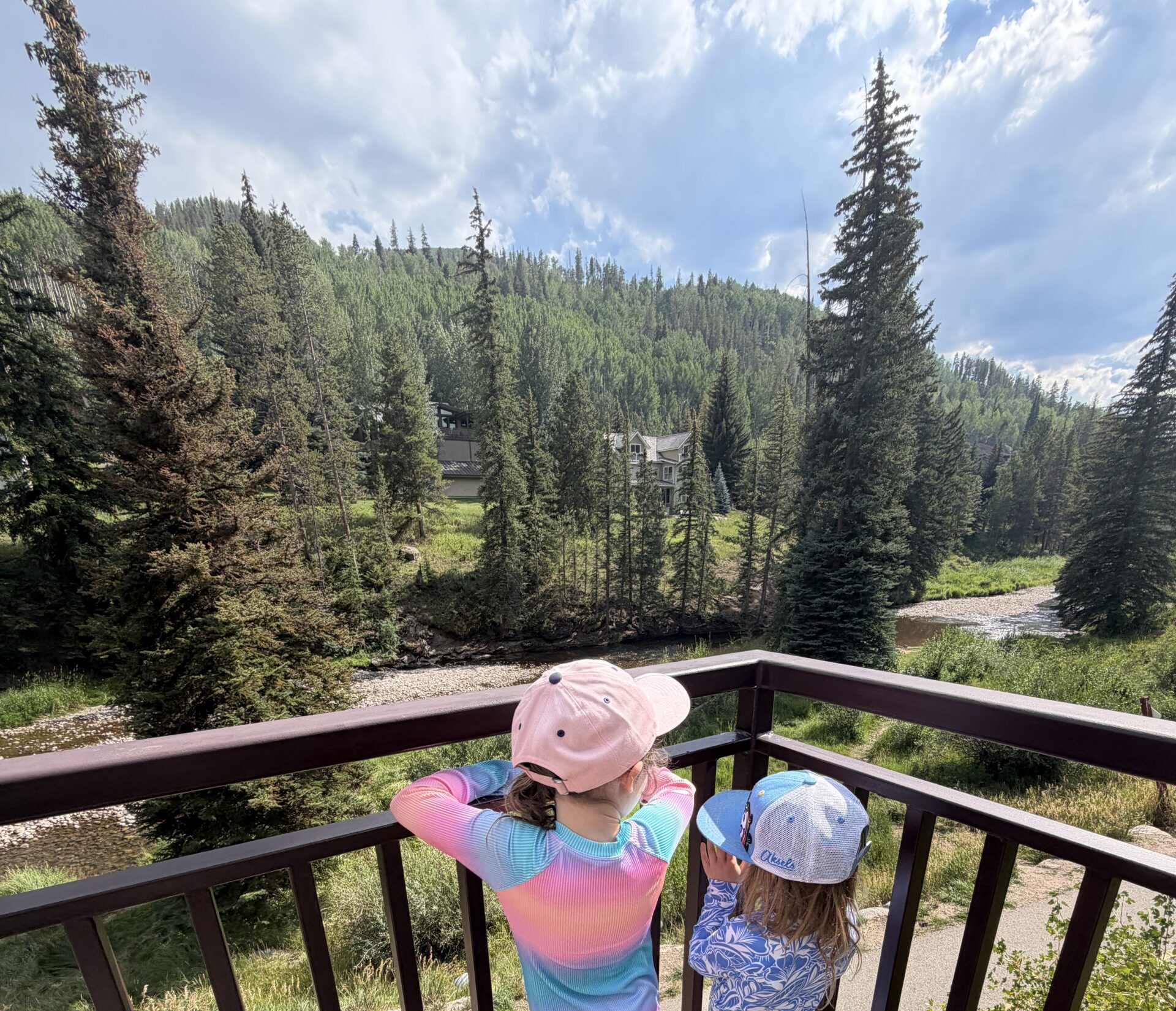 two girls overlooking mountains in vail colorado